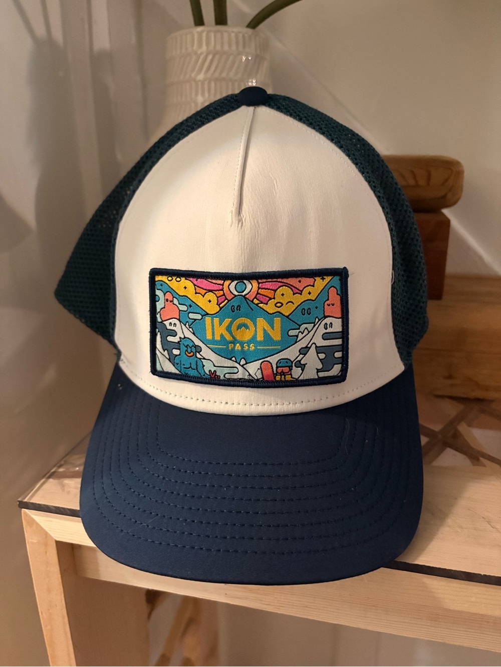 Ikon Pass Adult trucker hat features a vibrant embroidered patch with a mountain